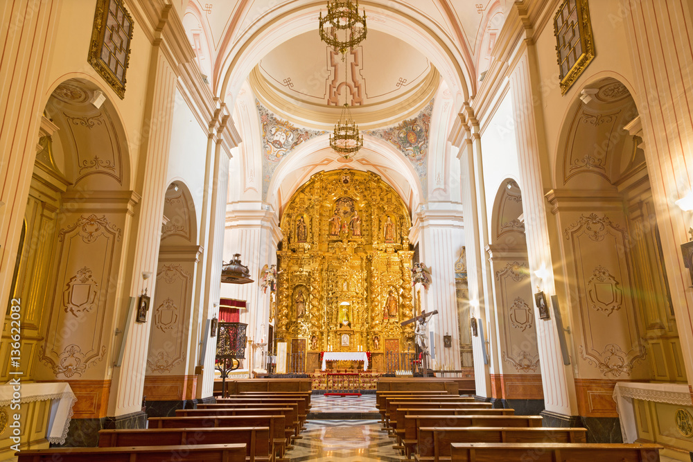 CORDOBA, SPAIN - MAY 26, 2015: The nave of church of Monastery of st. Ann and st.Joseph (Convento de Santa Ana y San Jose) with the main altar by Sanchez de Rueda (1710).