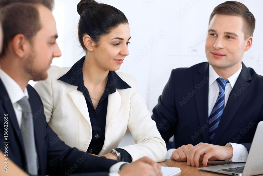 Group of business people and lawyers discussing contract papers at meeting Group of business people and lawyers discussing contract papers at meeting