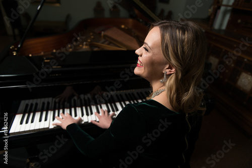 Musician Sitting and Playing Piano
