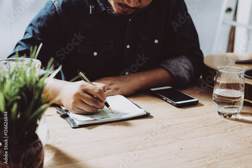Image of businessman working at work table,home office desk background, Desk musicians,checklist planning investigate enthusiastic concept.