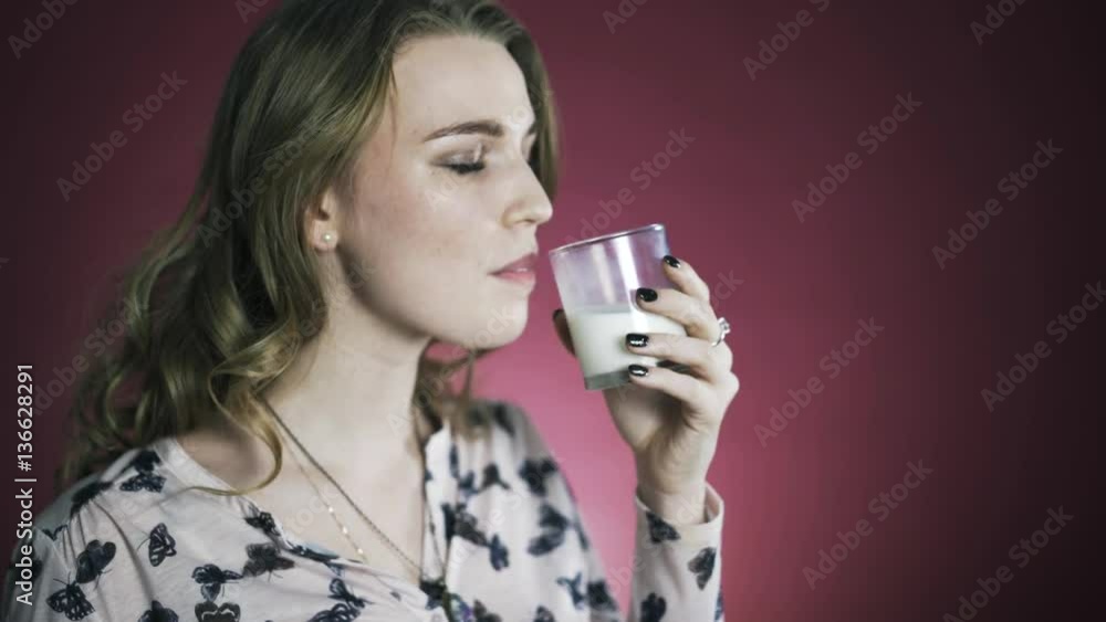 Woman enjoying fresh glass of milk. Locked down real time. Woman enjoying fresh glass of milk. Locked down real time.