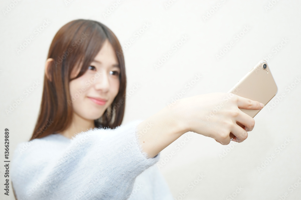 Young woman taking selfie photos with smile Young woman taking selfie photos with smile