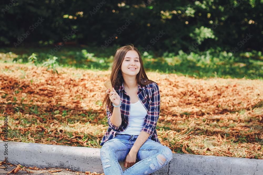 young beautiful girl walking park