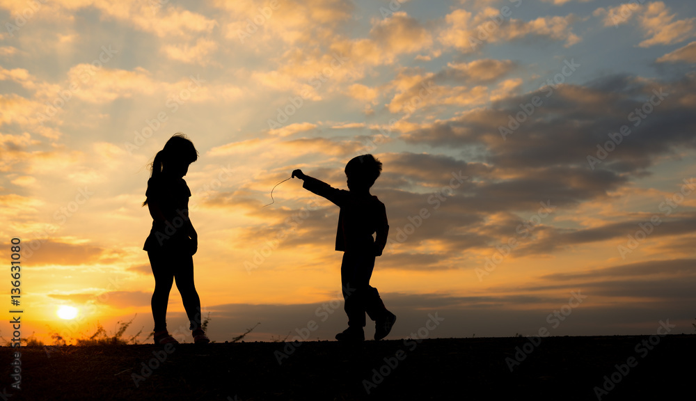 boy and girl at sunset time