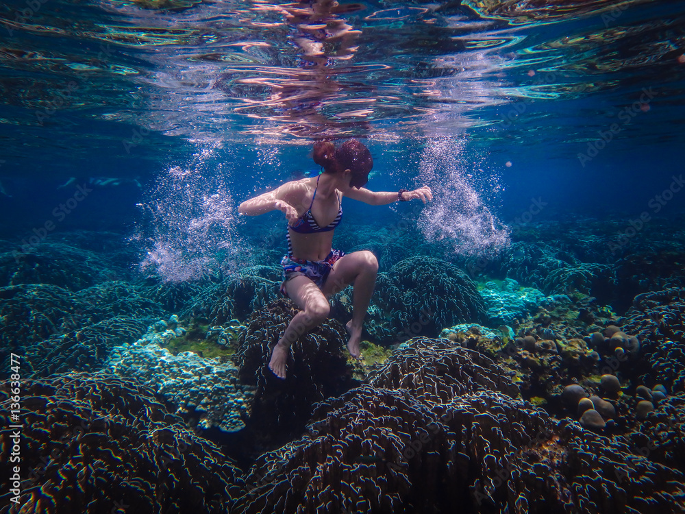 Underwater Photo of a Woman Diving , girl wearing bikini in action dive ...