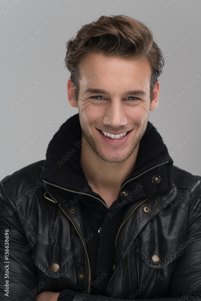 portrait of a young guy over gray background portrait of a young guy over gray background