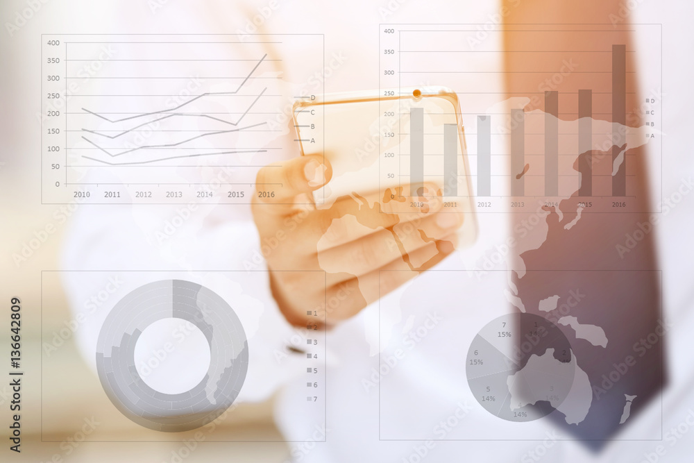 Asia business man hand touch screen on smartphone and business graph background. Asia business man hand touch screen on smartphone and business graph background.