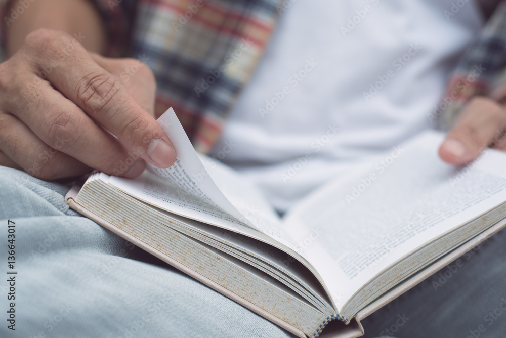 Young man reading book Young man reading book