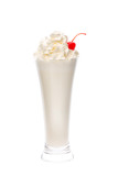 Milk coctail with whipped cream in the long glass