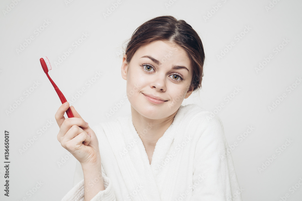 woman with toothbrush, surprised look woman with toothbrush, surprised look