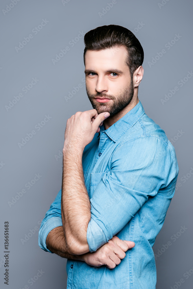 Portrait of handsome thoughtful man touching his chin Portrait of handsome thoughtful man touching his chin