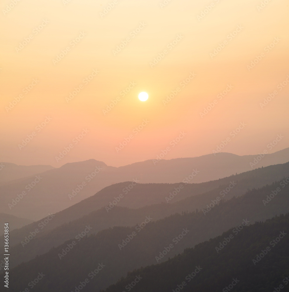 Mountain valley during sunrise. Natural landscape in the summer time