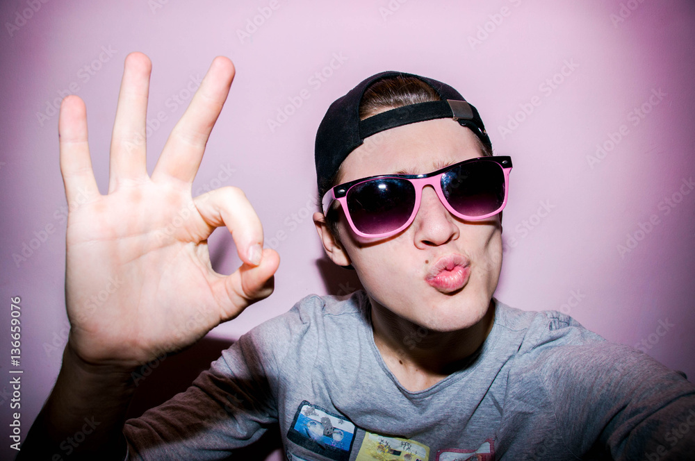 Young guy on the showing that everything is good Young guy on the showing that everything is good