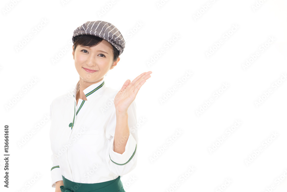 案内する笑顔のウェイトレス 案内する笑顔のウェイトレス