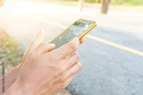 Man uses his Mobile Phone outdoor