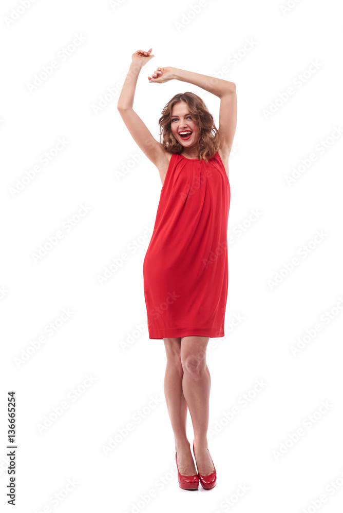 Cheerful woman with hands above head posing at the camera Cheerful woman with hands above head posing at the camera