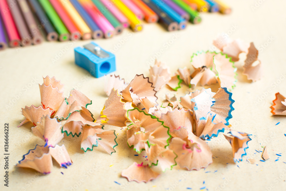 Wooden colorful pencils with sharpening shavings Wooden colorful pencils with sharpening shavings