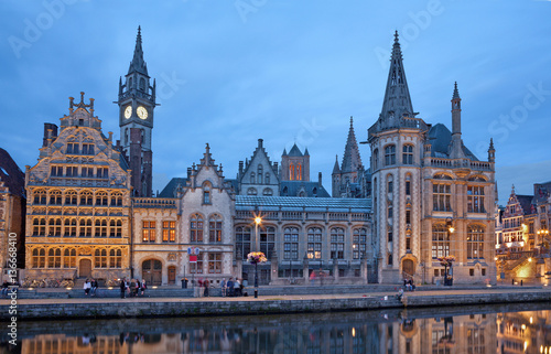 GHENT, BELGIUM - JUNE 23, 2012: Typical old palaces from Graselei street from 16. - 18. cent. and west facade of Post palace at dusk.