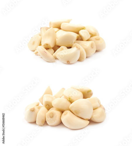 Pile of peeled garlic isolated