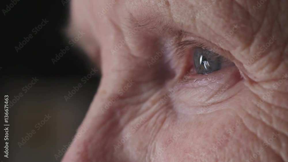 Slow motion closeup portrait of old womans face looking something, 180fps prores footage Slow motion closeup portrait of old womans face looking something, 180fps prores footage