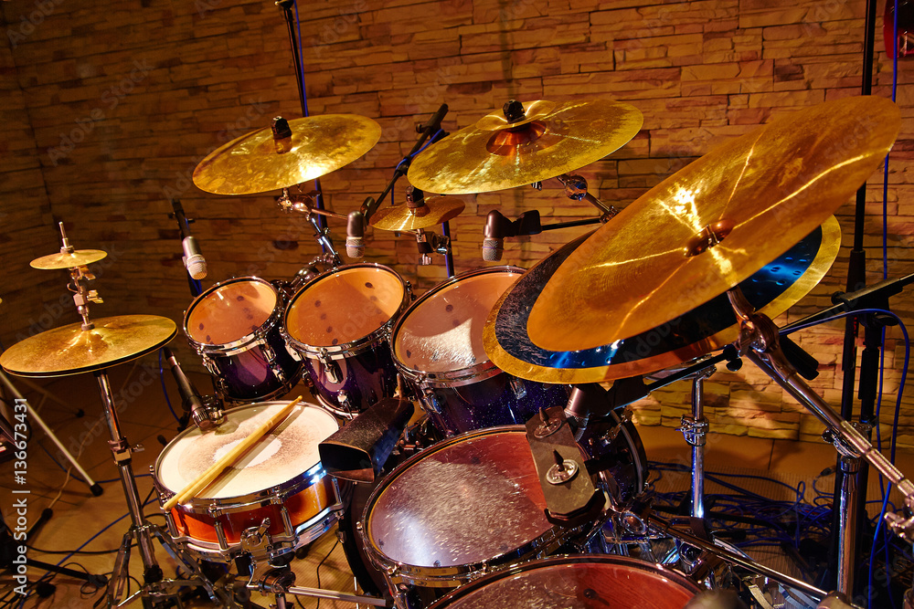 Obraz premium drum set with two wooden drumsticks on it