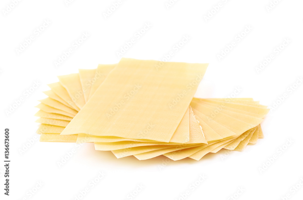 Pile of dried lasagna sheets isolated Pile of dried lasagna sheets isolated