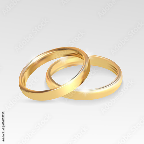 Wedding rings set of gold metal on gray background