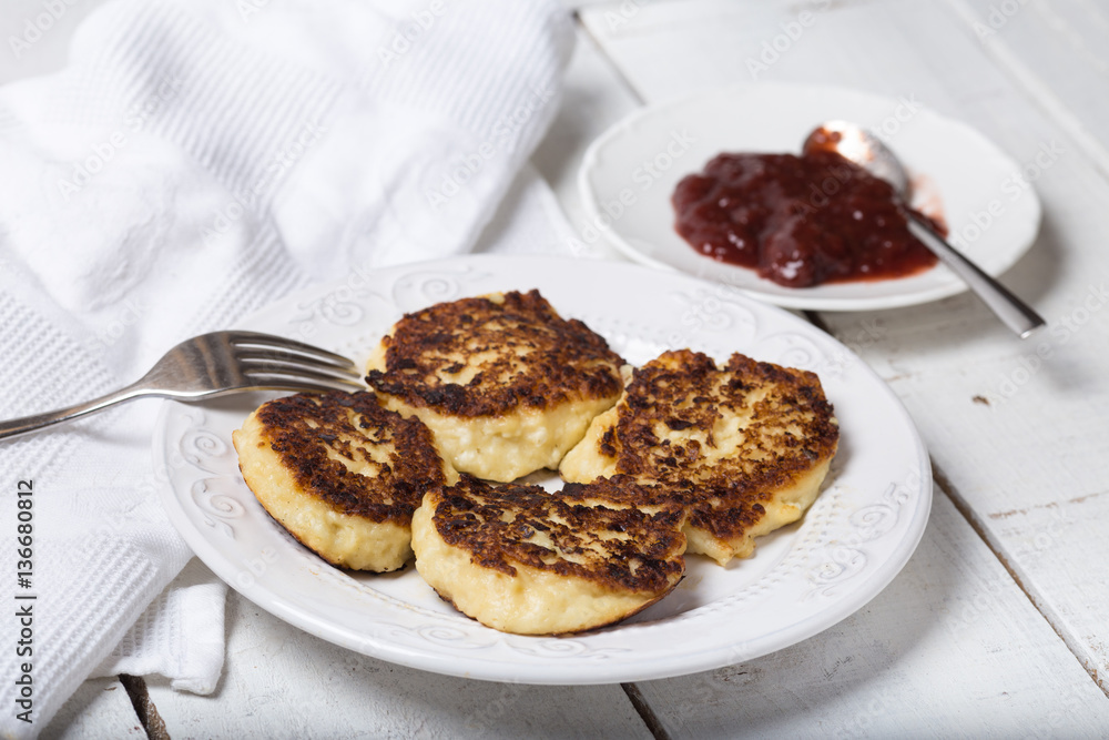 cheese pancake with jam on a plate cheese pancake with jam on a plate
