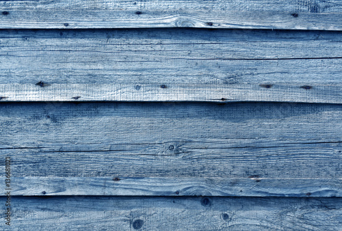 Blue toned wooden wall surface.