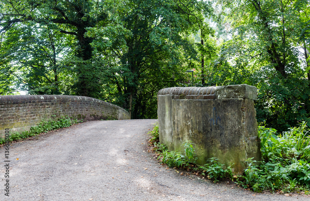 Old historic stone bridge at walk path in park hike trail at wat Old historic stone bridge at walk path in park hike trail at wat