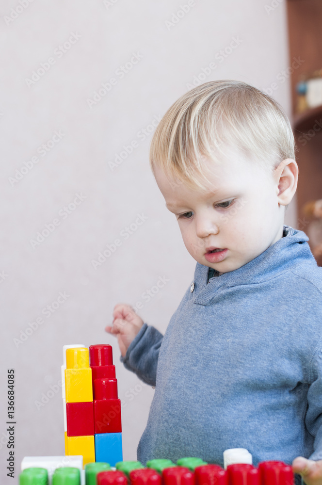 portrait of a child playing in the constructor portrait of a child playing in the constructor