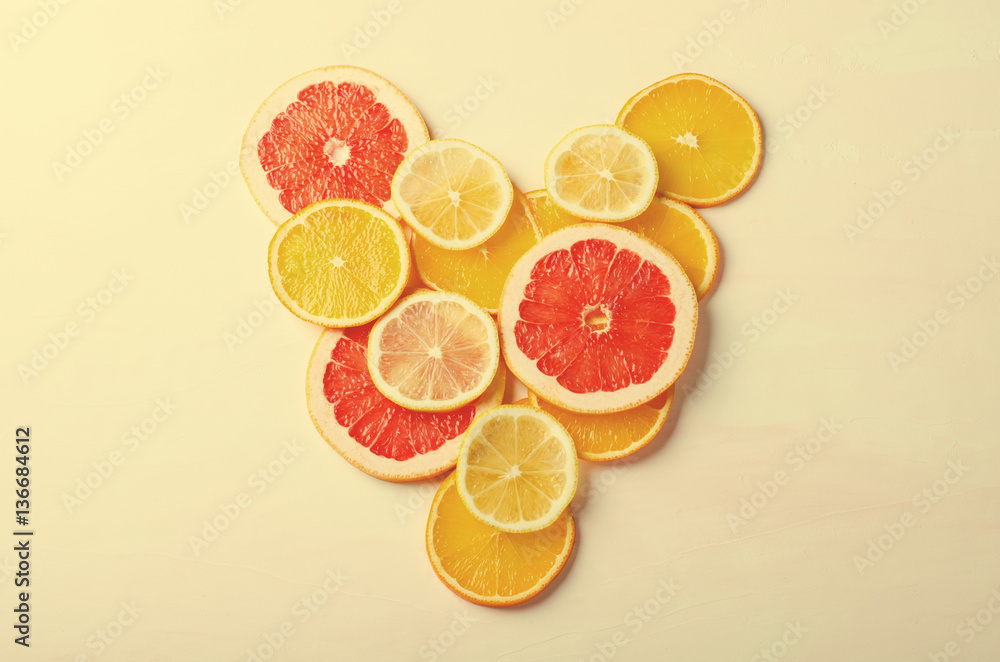 Citrus fruit Heart from slices of lemon, orange, grapefruit on white background. Love, healthy, ecology concept. Citrus fruit Heart from slices of lemon, orange, grapefruit on white background. Love, healthy, ecology concept.