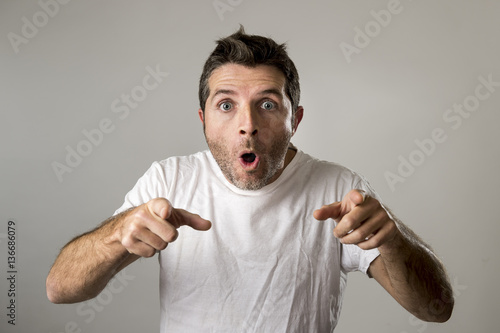 Принти на полотні young attractive man astonished amazed in shock surprise face expression and sho