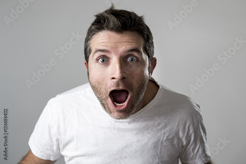 young attractive man astonished amazed in shock surprise face expression and shock emotion © Wordley Calvo Stock