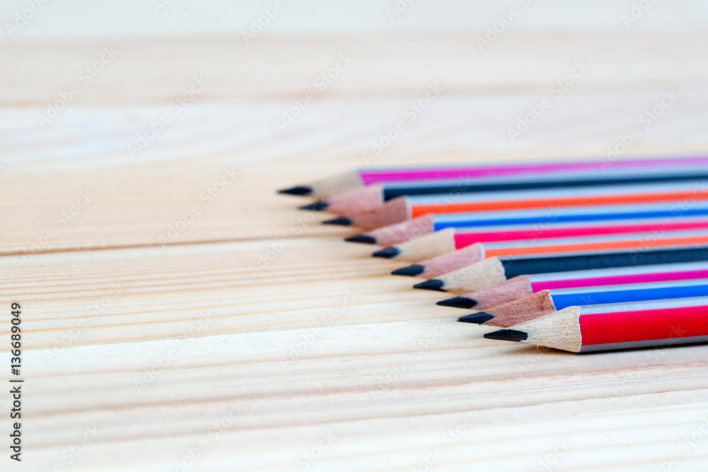 Obraz premium Pencils on a wooden table. Back to school