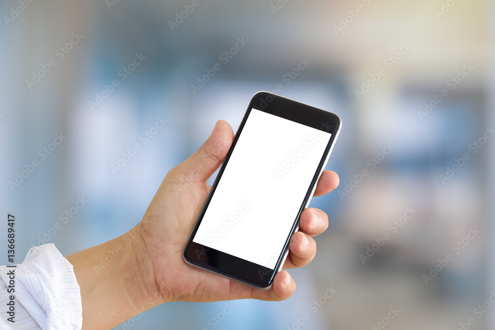 Man hands holding blank screen a smartphone and attract background. Man hands holding blank screen a smartphone and attract background.