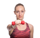 Attractive cheerful young fitness doing workout with red dumbbells. Isolated over white background.