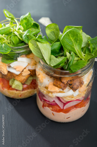 Two glass jars with fresh salad