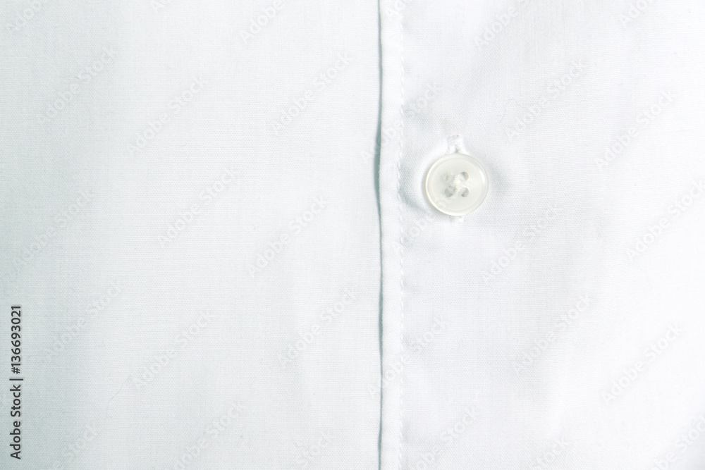 Shirt button detail. White cotton fabric. Empty copy space for Editor's text. Shirt button detail. White cotton fabric. Empty copy space for Editor's text.