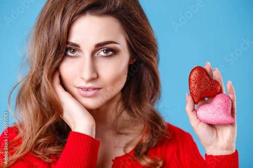 Love and valentines day woman holding red and pink hearts © selenit