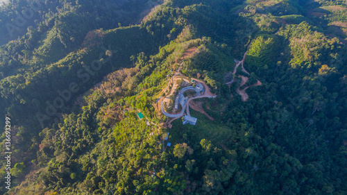 see fog in forest on hilltop inside the middle field of national park © Narong Niemhom