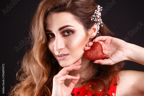 Love and valentines day woman holding heart smiling cute and adorable