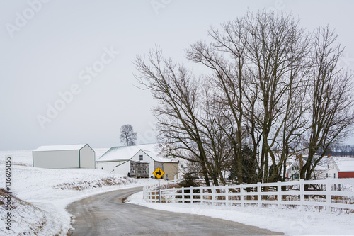 Road and view of snow covered farm, near Jefferson, Pennsylvania