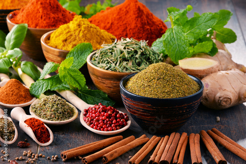 Variety of spices and herbs on kitchen table