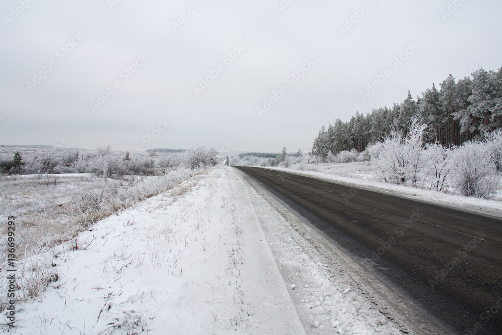 Winter road and snowy landscape Winter road and snowy landscape