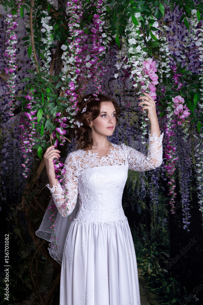 Beauty Portrait of bride wearing in wedding dress with voluminous skirt, studio photo Beauty Portrait of bride wearing in wedding dress with voluminous skirt, studio photo