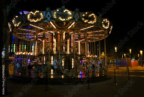 Night view of the illuminated vintage carousel