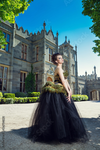 Gorgeous Woman in Evening retro dress Posing near old palace. Vorontsov Palace. Crimea