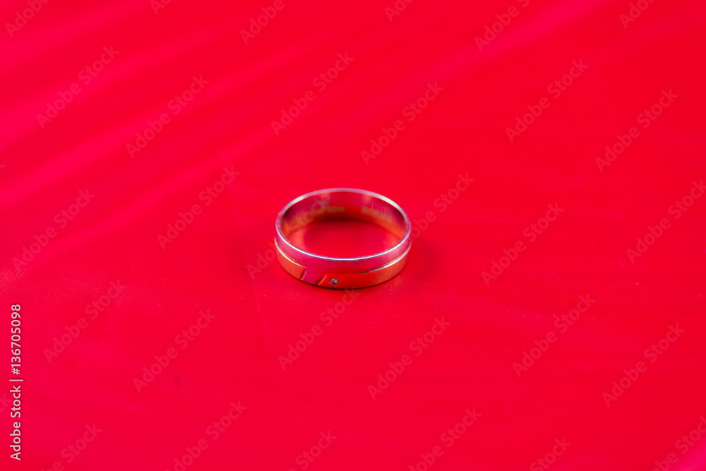 wedding ring on red background wedding ring on red background