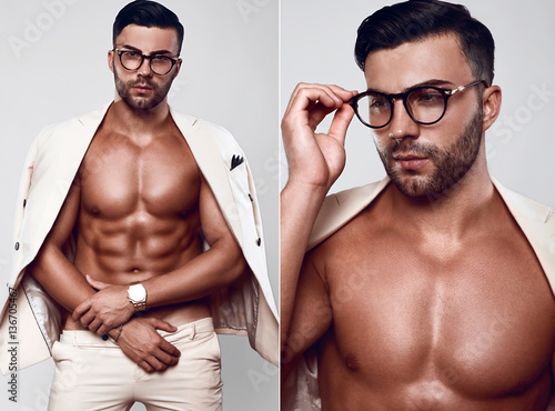 Elegant fit brutal man model in a light suit and glasses